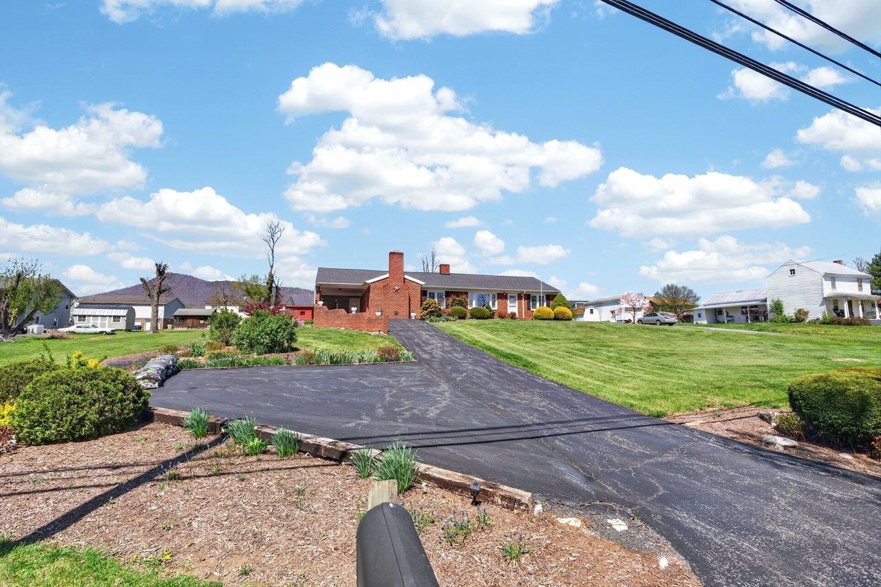 9625 Town Hall Road McGaheysville, VA 22840 - Photo 64 of 65 a view of a garden with a building in the background