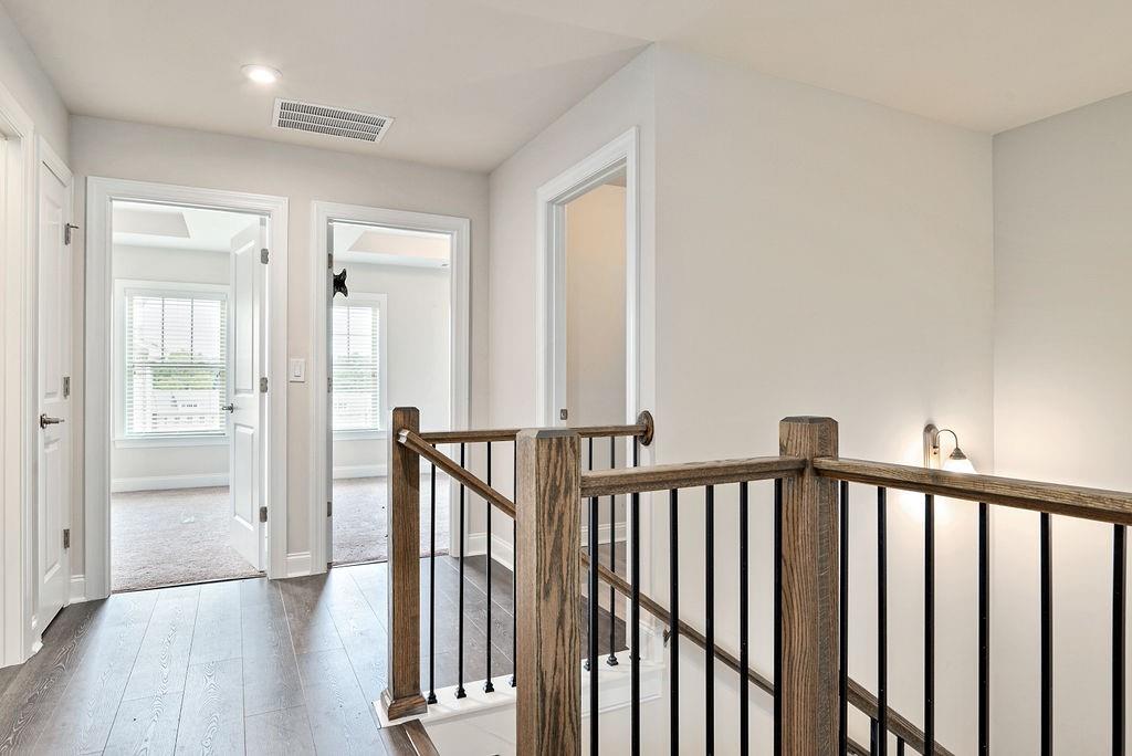 1395 Harris Way Street Brookhaven, GA 30319 - Photo 14 of 28 a view of a hallway with wooden floor and windows