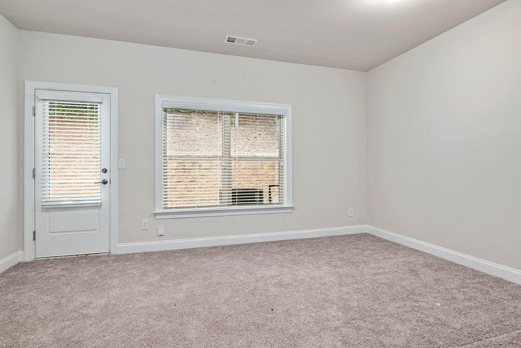 1395 Harris Way Street Brookhaven, GA 30319 - Photo 22 of 28 an empty room with a window