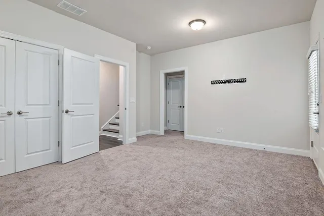 a bathroom with a bathtub shower sink mirror vanity and toilet