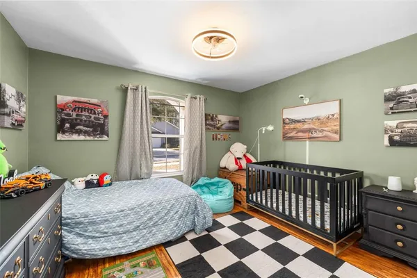 a bedroom with furniture and a window
