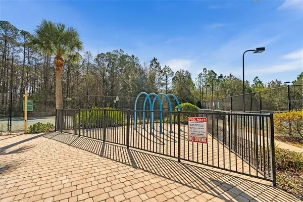 a view of a wrought iron fences in front of house