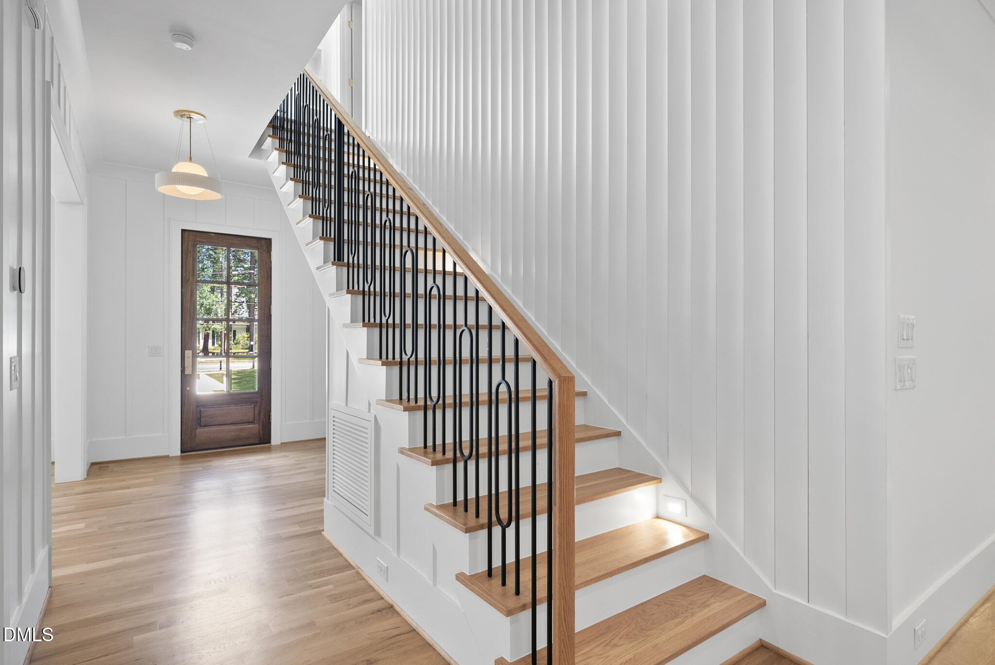1609 Ridge Road Raleigh, NC 27607 - Photo 33 of 62 a view of a hallway with wooden floor and entryway