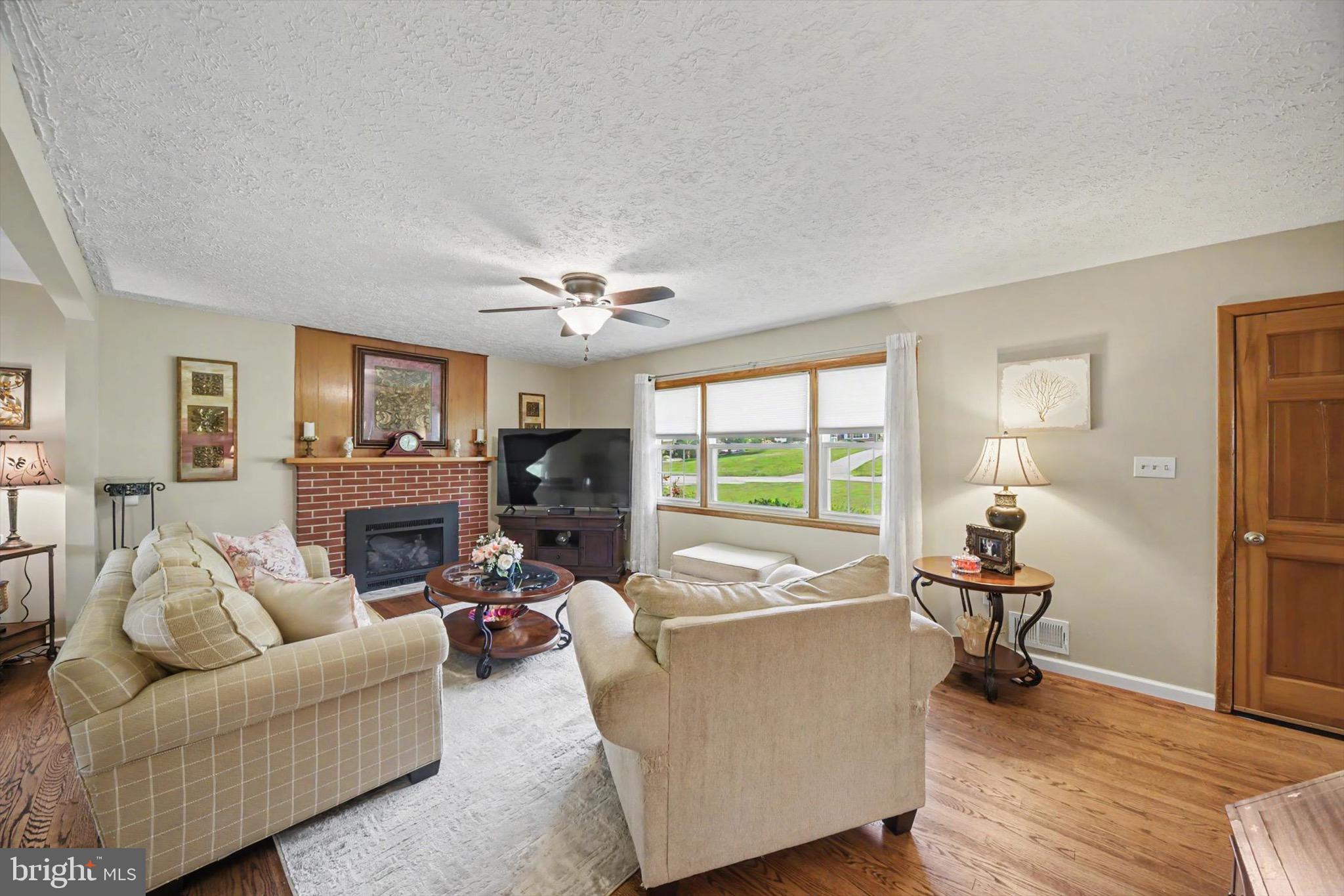 406 Plumtree Road Bel Air, MD 21015 - Photo 12 of 59 Gas Fireplace with Brick Surround, Tile Hearth