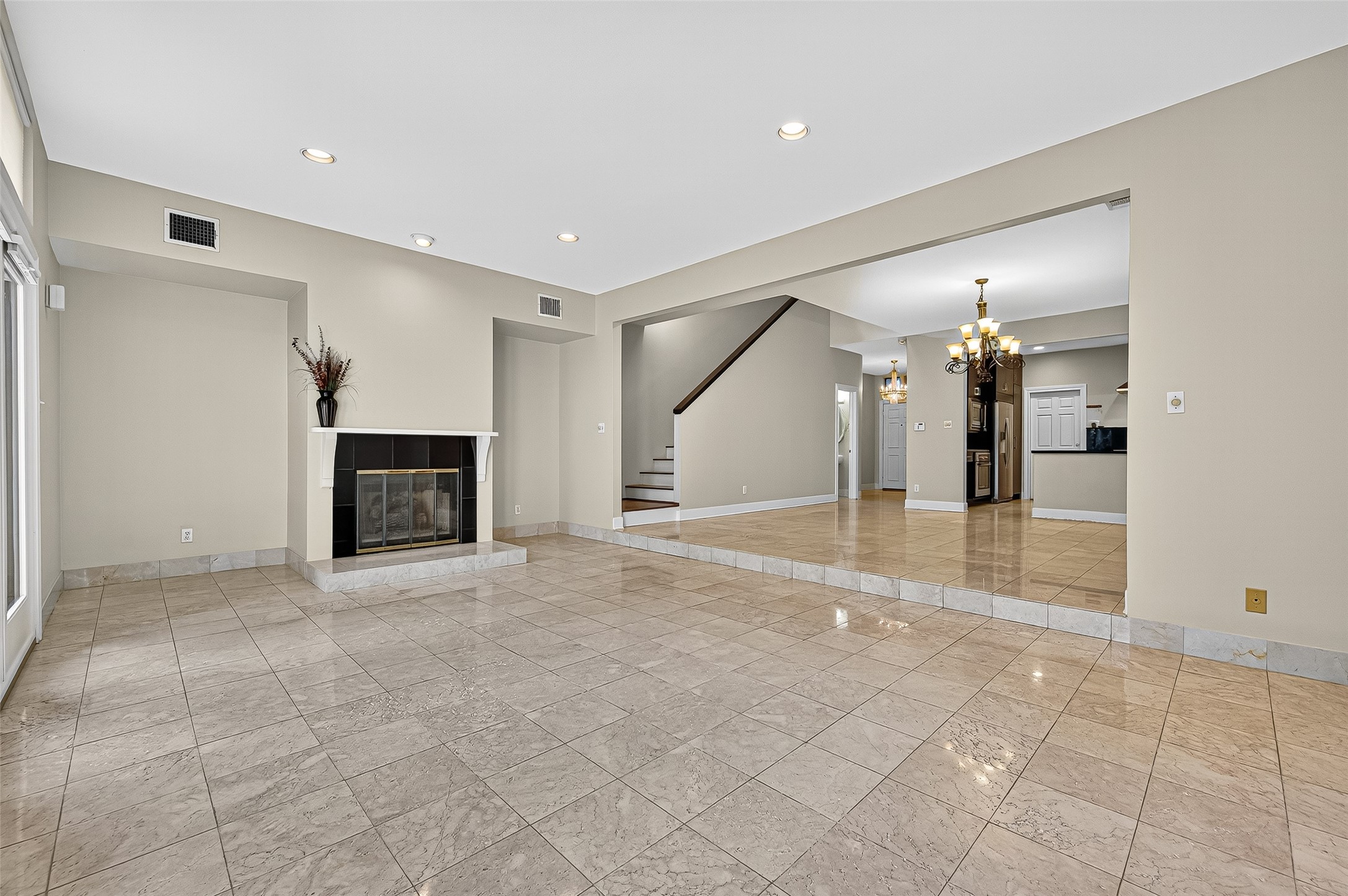 3027 Bissonnet Street Houston, TX 77005 - Photo 12 of 47
Living room with fireplace and polished floors — comfortable and easy to make your own