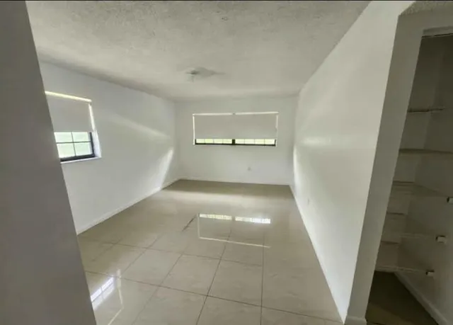 a bathroom with a sink toilet and mirror