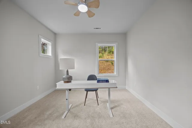 a workspace with furniture and window