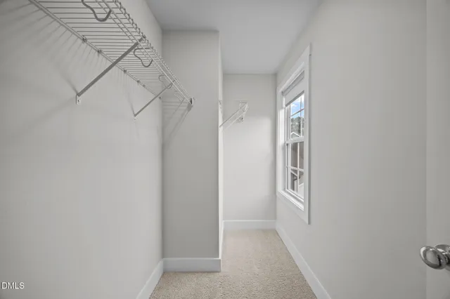 a bathroom with a shower sink vanity mirror and toilet