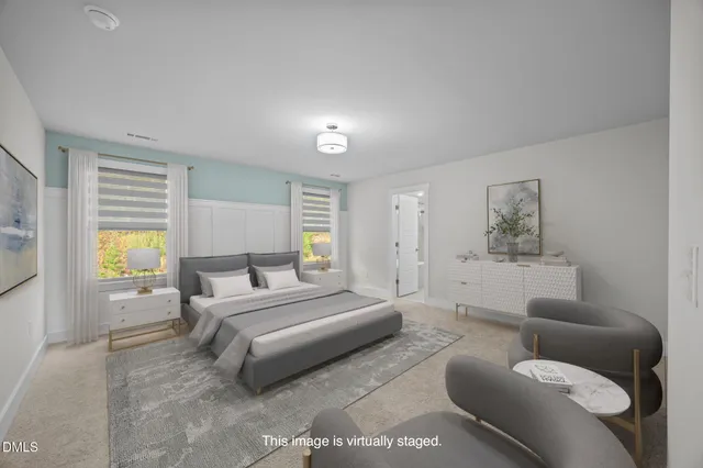 a bedroom with a bed and a couch