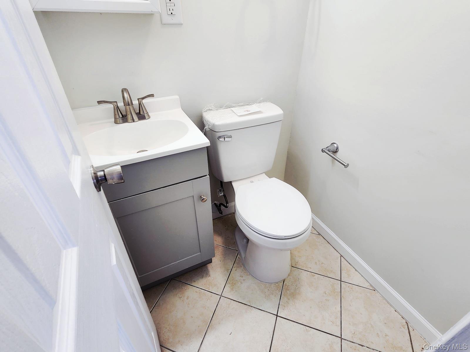 112 Union Road, Unit 3L Spring Valley, NY 10977 - Photo 13 of 19 a white toilet sitting next to a white sink