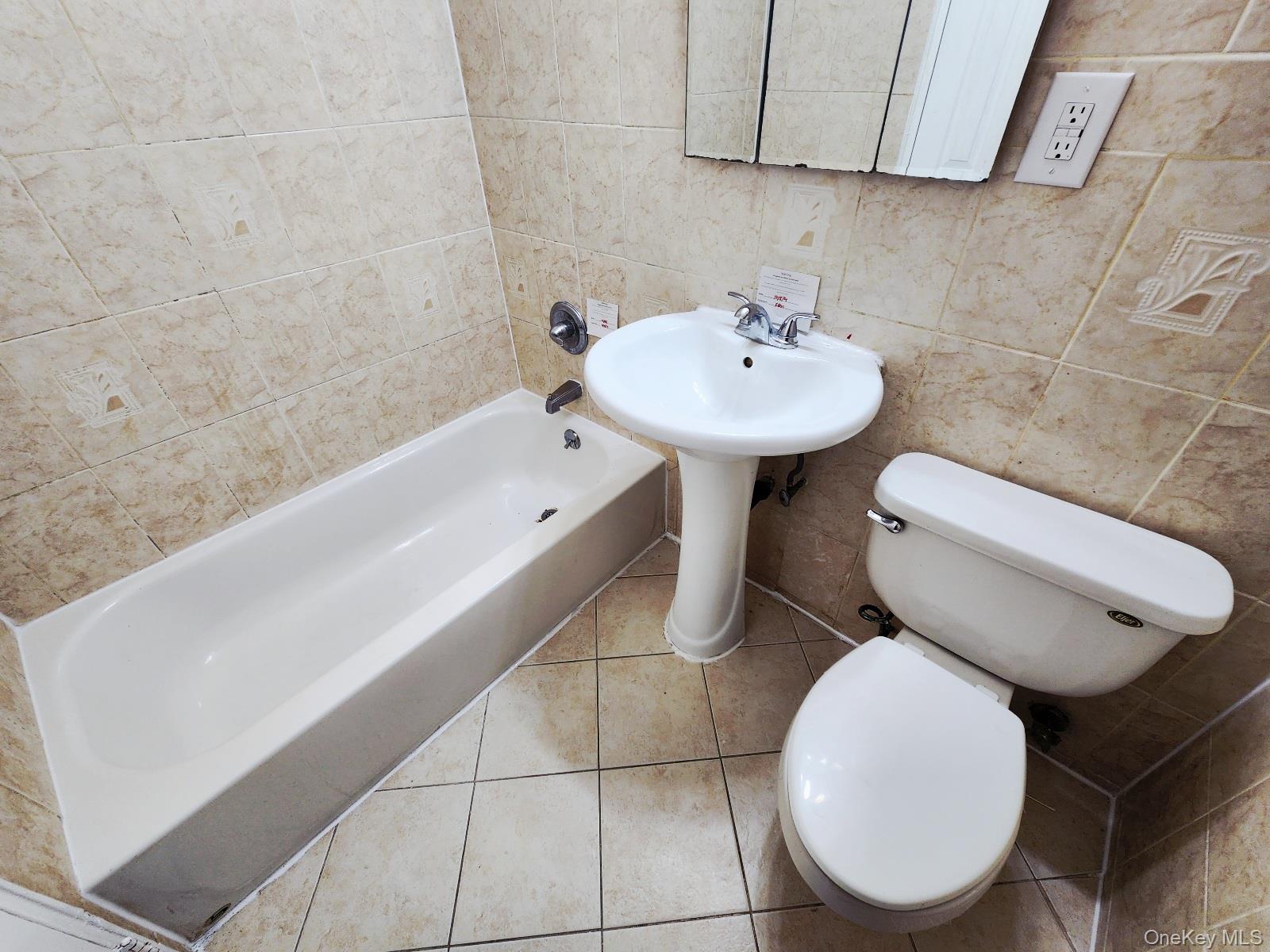 112 Union Road, Unit 3L Spring Valley, NY 10977 - Photo 17 of 19 a bathroom with a sink mirror and toilet