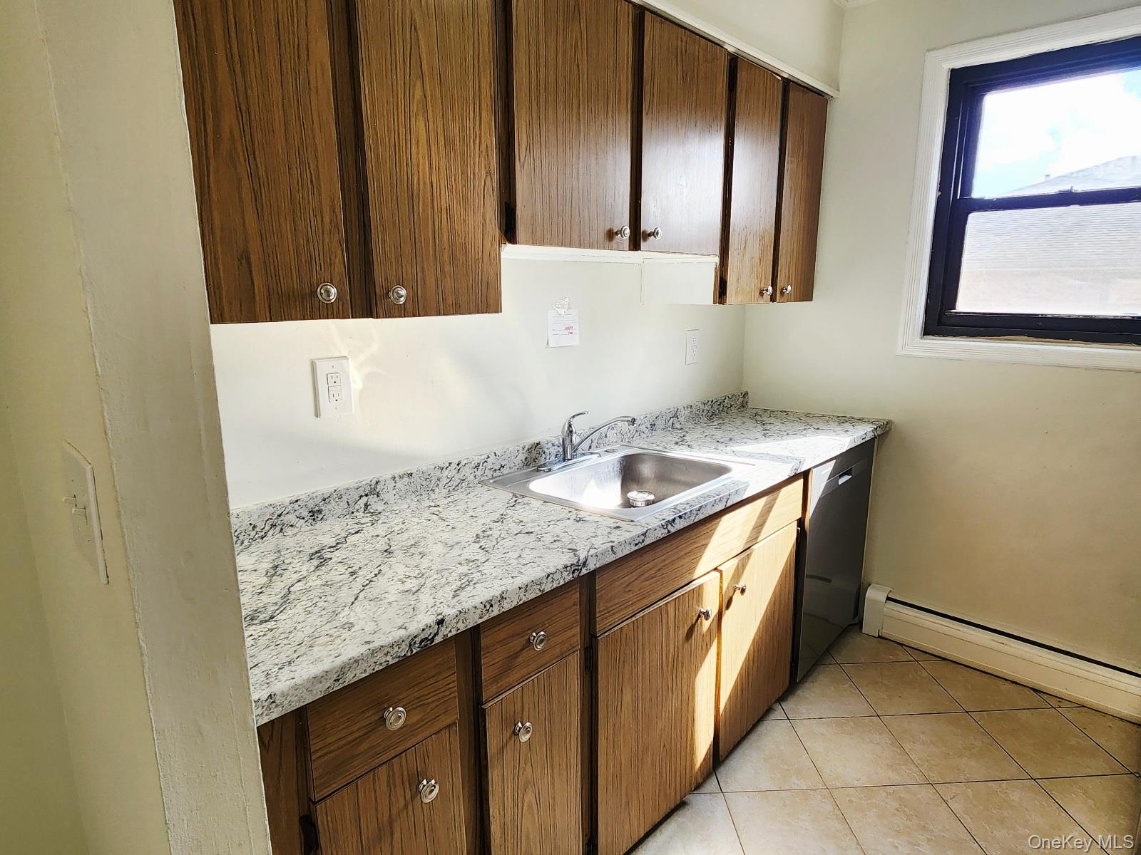 112 Union Road, Unit 3L Spring Valley, NY 10977 - Photo 9 of 19 a kitchen with granite countertop sink and cabinets
