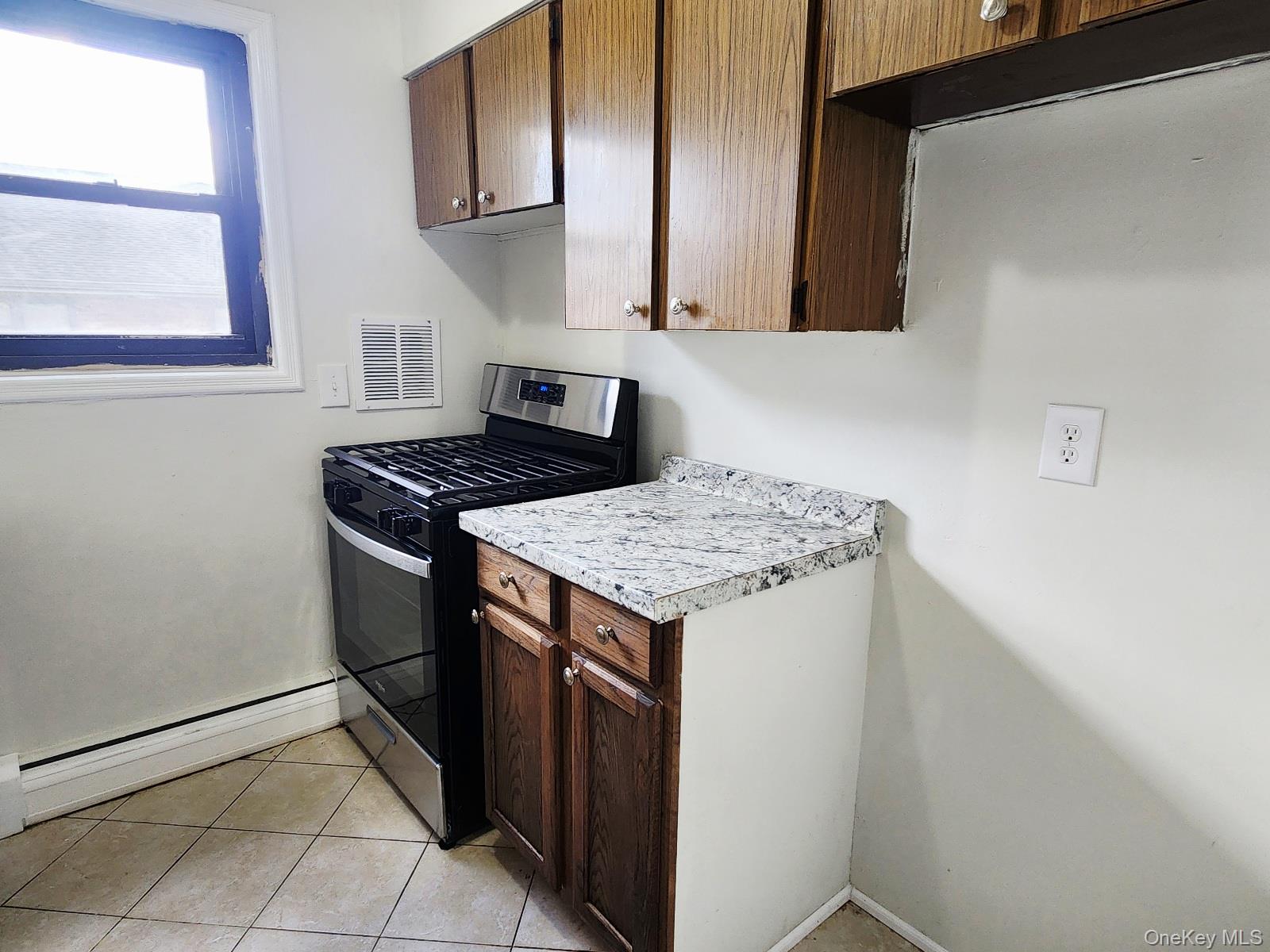 112 Union Road, Unit 3L Spring Valley, NY 10977 - Photo 10 of 19 a kitchen with a stove and a refrigerator