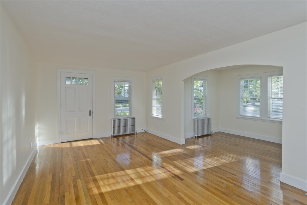 1350 Wilbraham Road Springfield, MA 01119 - Photo 11 of 35 a view of empty room with wooden floor and fan
