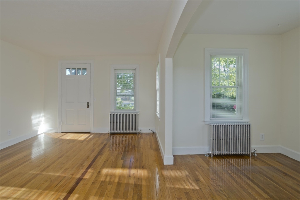 1350 Wilbraham Road Springfield, MA 01119 - Photo 15 of 35 a view of empty room with wooden floor and fan