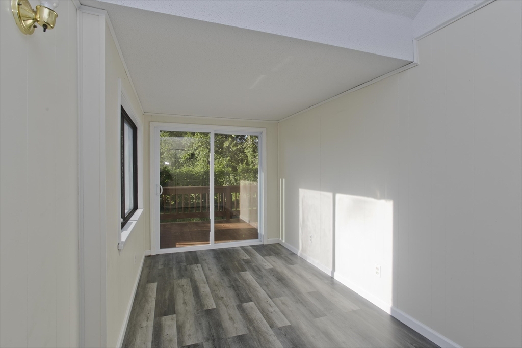 1350 Wilbraham Road Springfield, MA 01119 - Photo 23 of 35 an empty room with wooden floor and windows