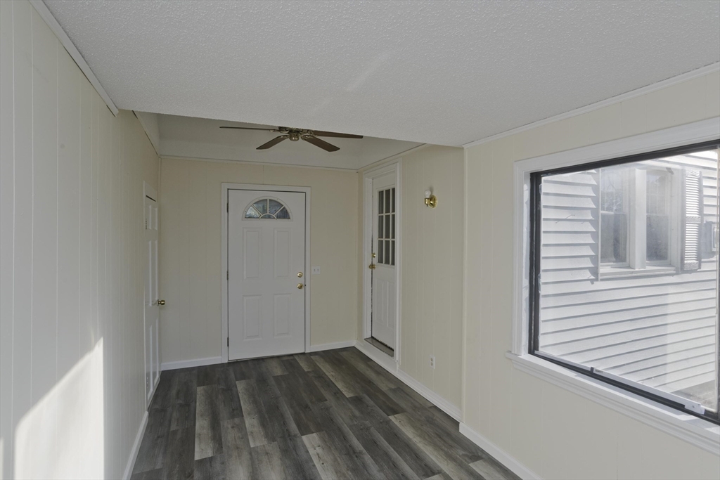 1350 Wilbraham Road Springfield, MA 01119 - Photo 24 of 35 a view of an empty room with wooden floor and a window