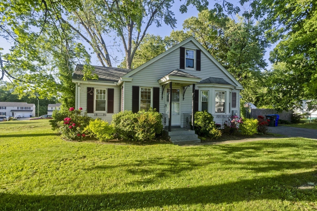 1350 Wilbraham Road Springfield, MA 01119 - Photo 3 of 35 a front view of a house with a yard