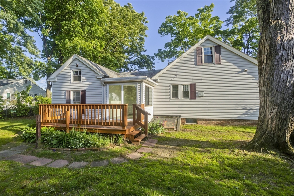 1350 Wilbraham Road Springfield, MA 01119 - Photo 32 of 35 a front view of a house with a yard table and chairs