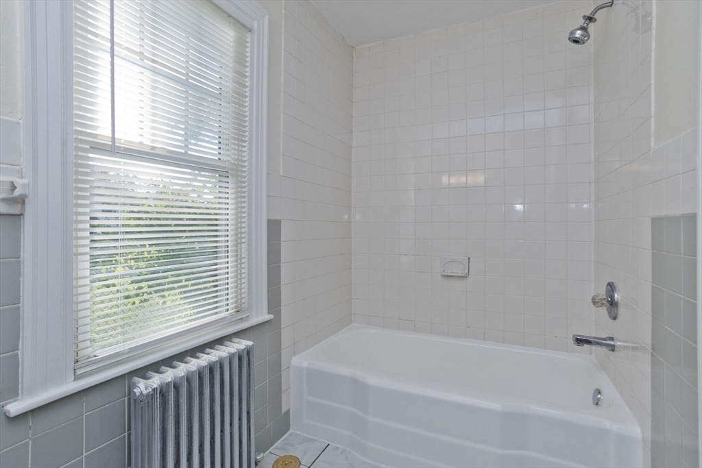 1350 Wilbraham Road Springfield, MA 01119 - Photo 9 of 35 a white bath tub sitting next to a window