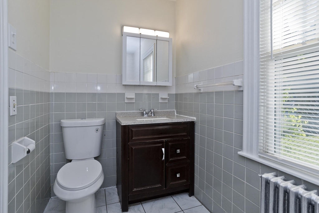 1350 Wilbraham Road Springfield, MA 01119 - Photo 10 of 35 a bathroom with a sink and a toilet