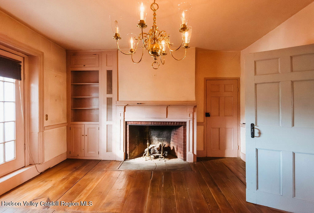 652 Albany Post Road New Paltz, NY 12561 - Photo 9 of 36 a view of a livingroom with a fireplace and window