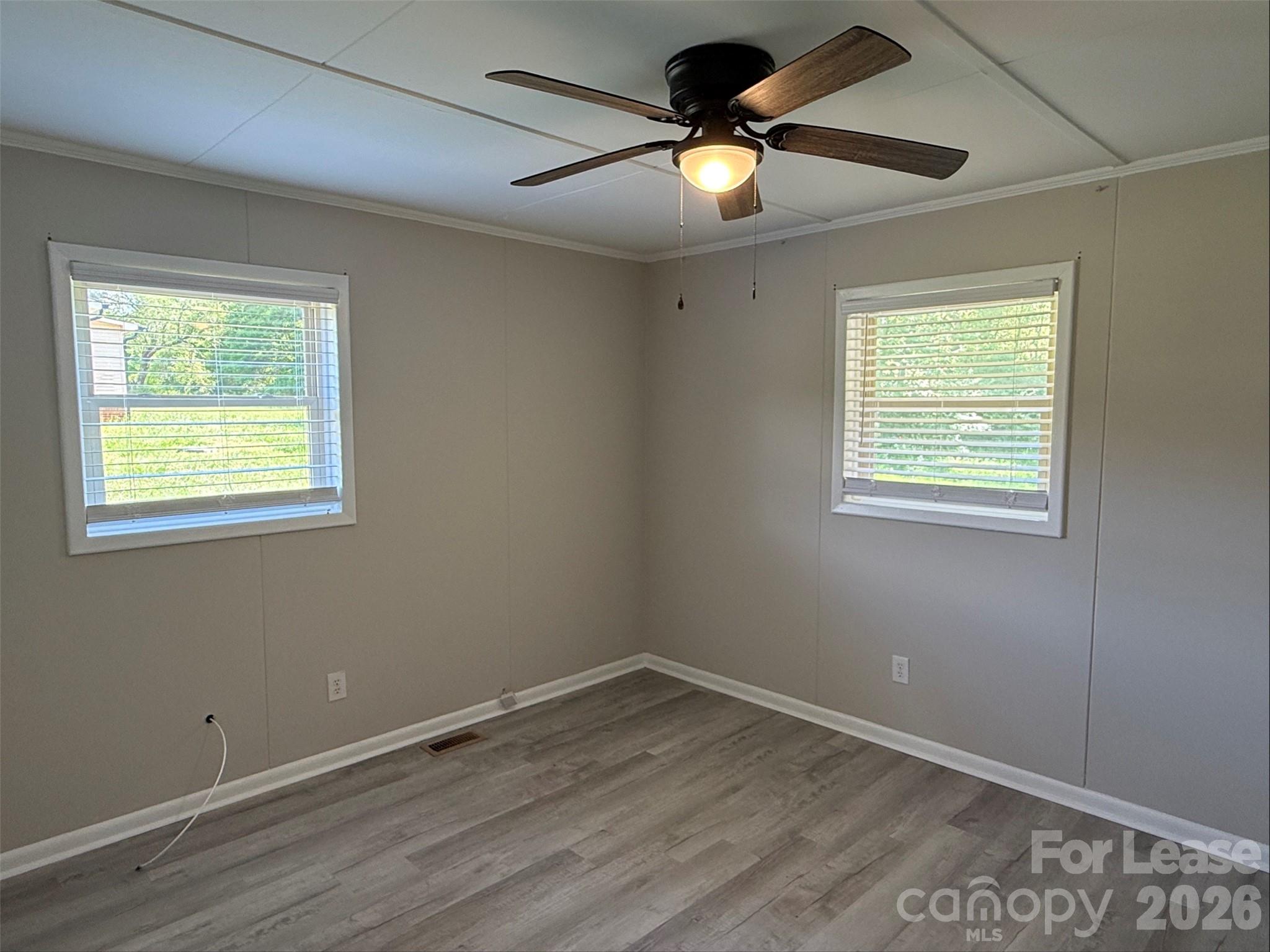 1771 River Road Lincolnton, NC 28092 - Photo 6 of 12 a view of an empty room with a window and wooden floor