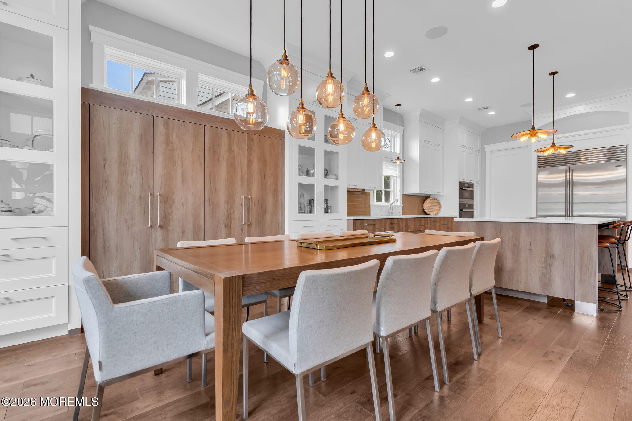 218 Worthington Avenue Spring Lake, NJ 07762 - Photo 15 of 51 a dining area with a table chairs and a kitchen view