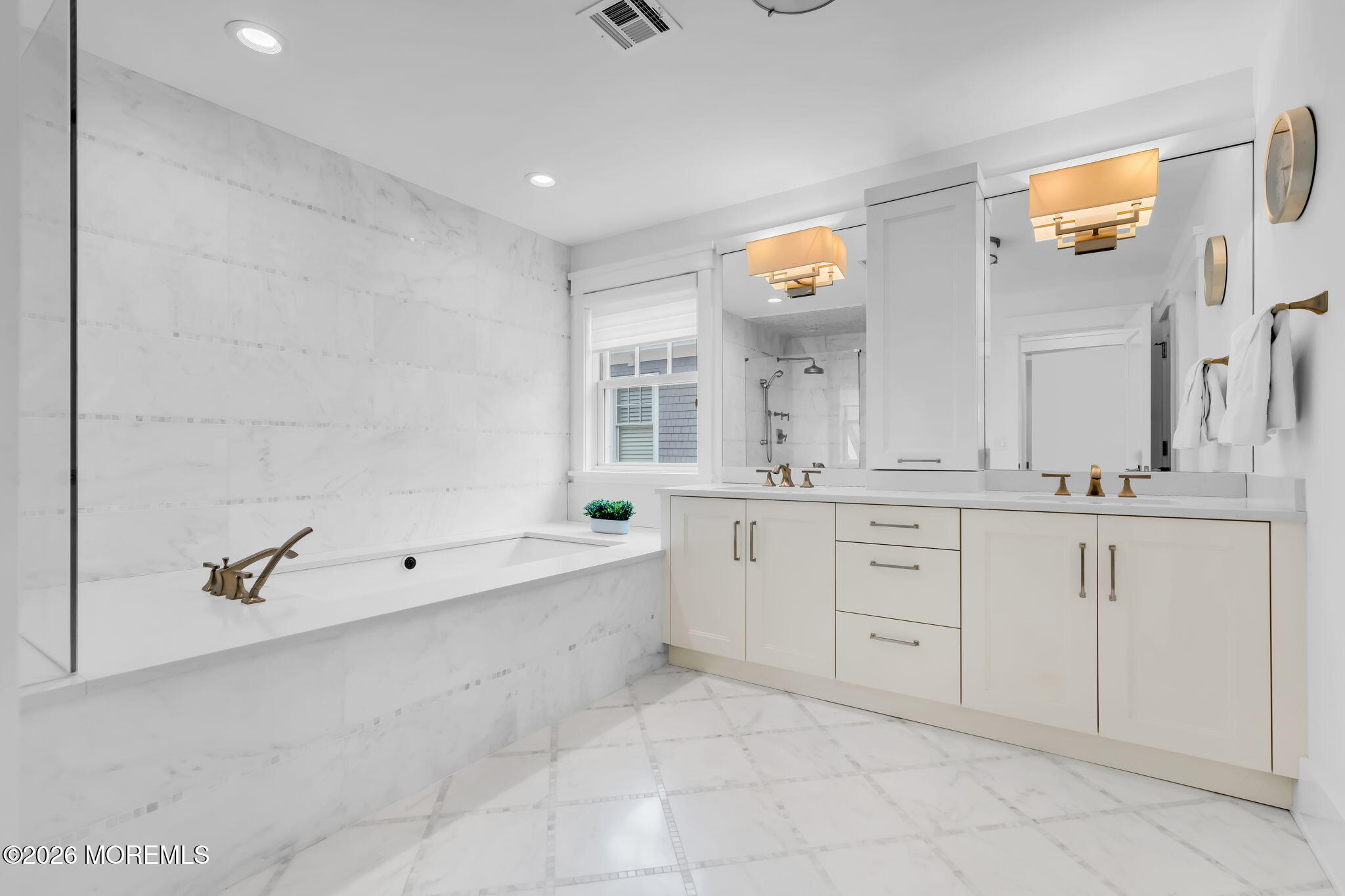218 Worthington Avenue Spring Lake, NJ 07762 - Photo 24 of 51 a spacious bathroom with a granite countertop sink a mirror and a bathtub