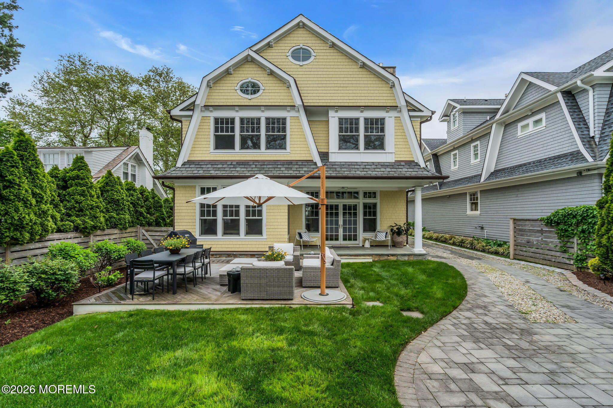 218 Worthington Avenue Spring Lake, NJ 07762 - Photo 45 of 51 a front view of a house with a yard table and chairs