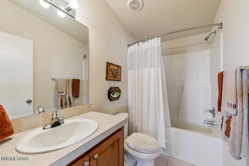 231 Atcheson Yerington, NV 89447 - Photo 21 of 30 a bathroom with a sink toilet and shower