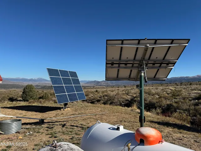 a view of a balcony with wooden floor and fence