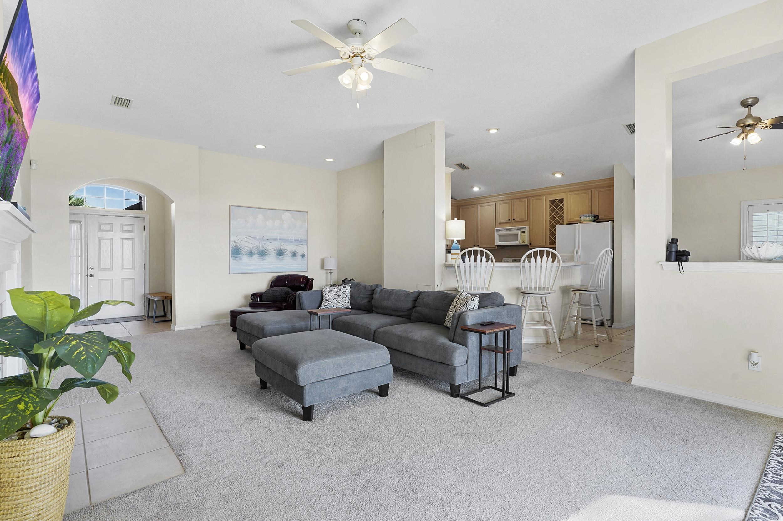 338 South Ocean Trace Road St. Augustine, FL 32080 - Photo 12 of 41 a living room with furniture and a large window