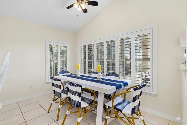 a kitchen with white cabinets sink and white appliances