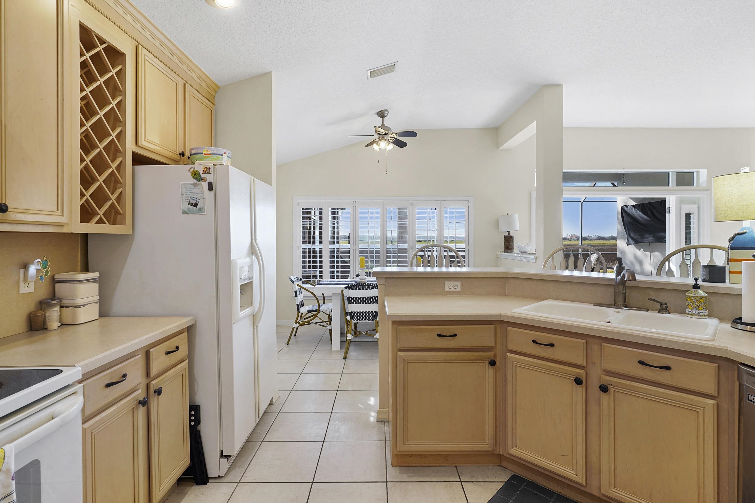 338 South Ocean Trace Road St. Augustine, FL 32080 - Photo 15 of 41 a kitchen with a sink cabinets and appliances