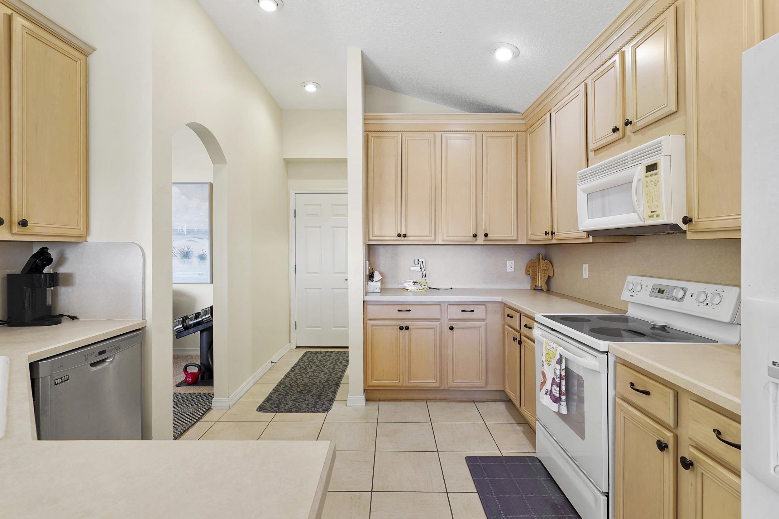 338 South Ocean Trace Road St. Augustine, FL 32080 - Photo 16 of 41 a kitchen with stainless steel appliances granite countertop a stove and a sink