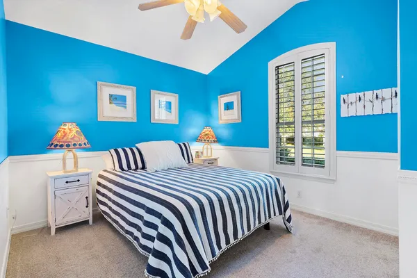 a bedroom with a bed and a dresser