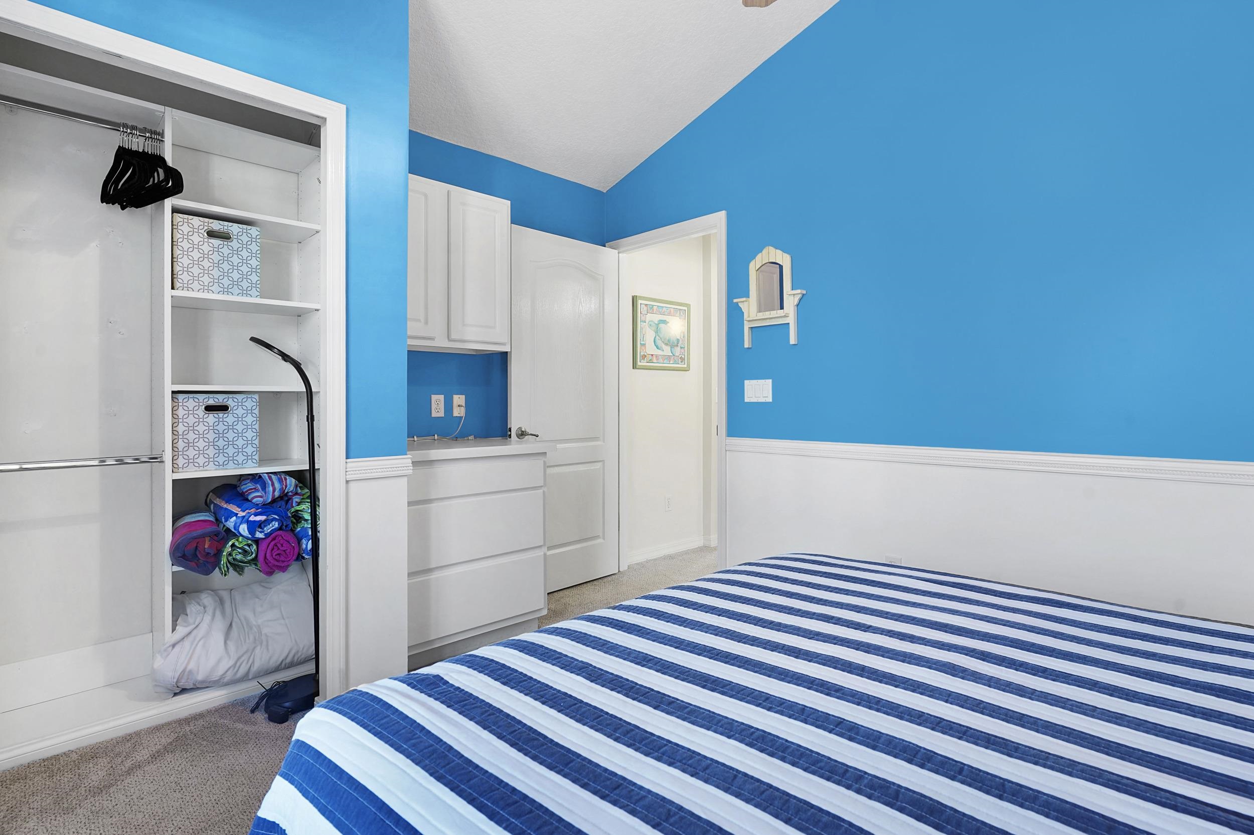 338 South Ocean Trace Road St. Augustine, FL 32080 - Photo 22 of 41 a bedroom with a bed and a dresser