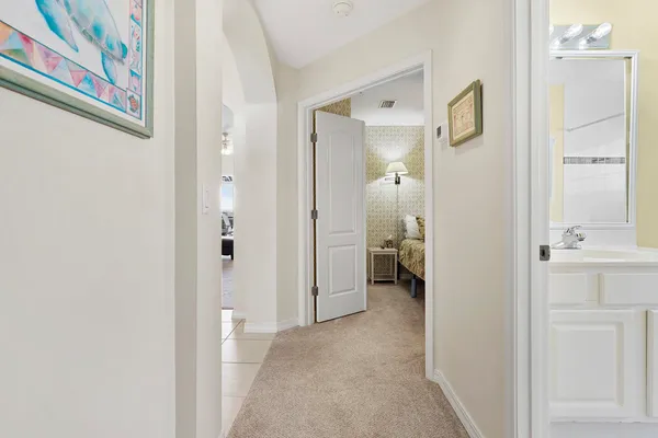a bathroom with a sink toilet vanity granite tub and shower