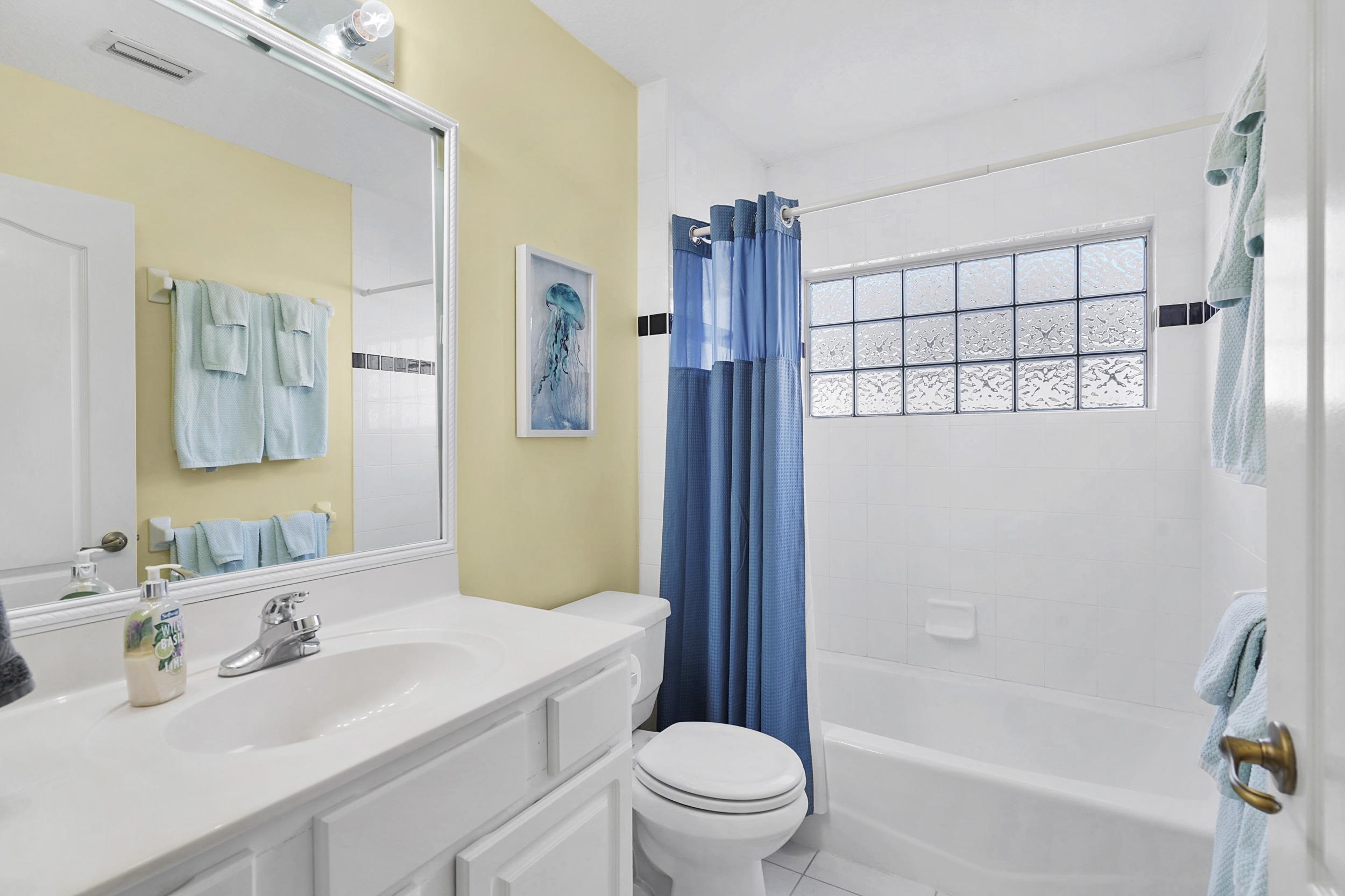 338 South Ocean Trace Road St. Augustine, FL 32080 - Photo 24 of 41 a bathroom with a sink toilet vanity granite tub and shower