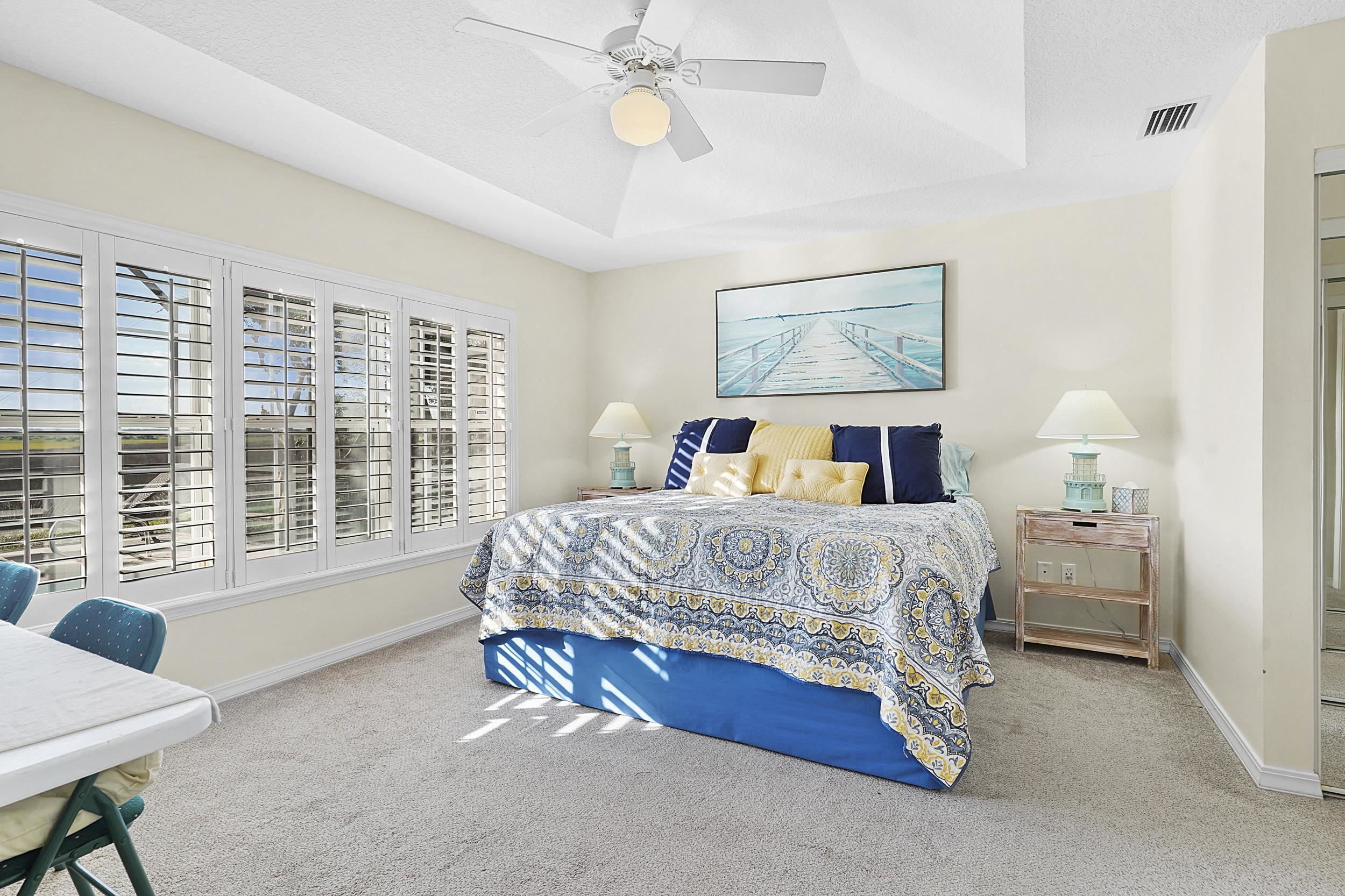 338 South Ocean Trace Road St. Augustine, FL 32080 - Photo 25 of 41 a bedroom with a large bed and a window