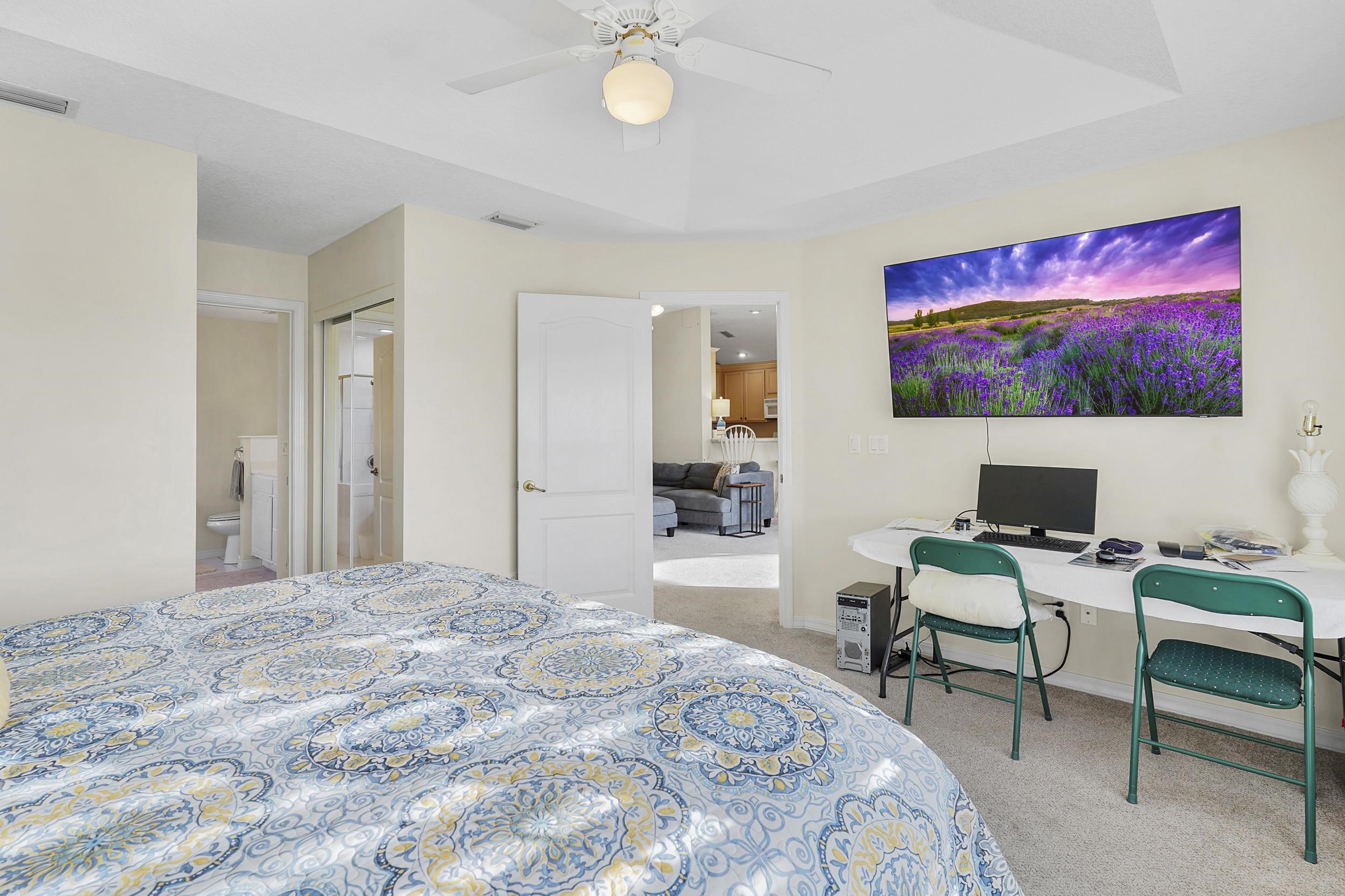 338 South Ocean Trace Road St. Augustine, FL 32080 - Photo 27 of 41 a bedroom with a bed and a flat screen tv