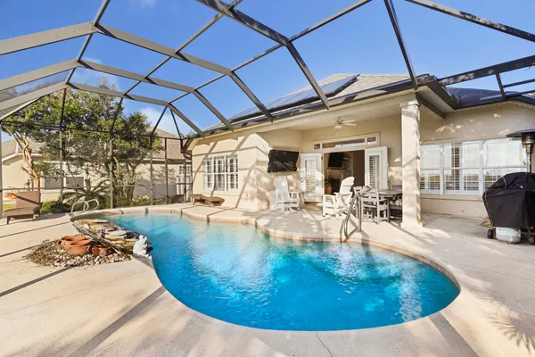a view of a swimming pool with a porch