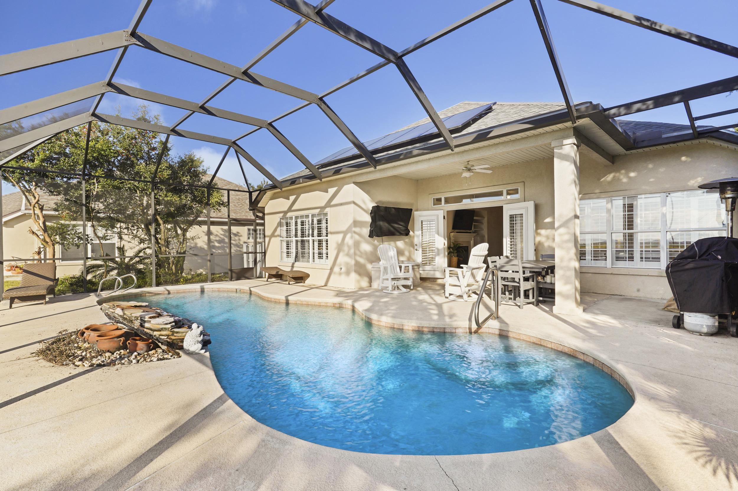 338 South Ocean Trace Road St. Augustine, FL 32080 - Photo 32 of 41 a view of a swimming pool with outdoor seating