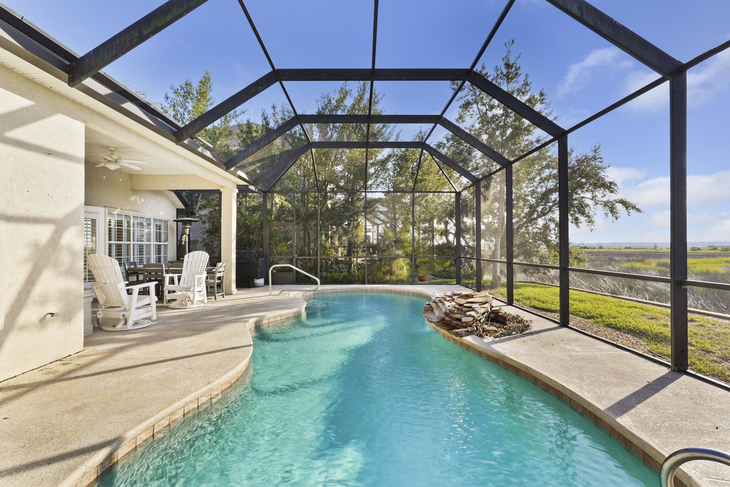 338 South Ocean Trace Road St. Augustine, FL 32080 - Photo 33 of 41 a view of a swimming pool with a porch