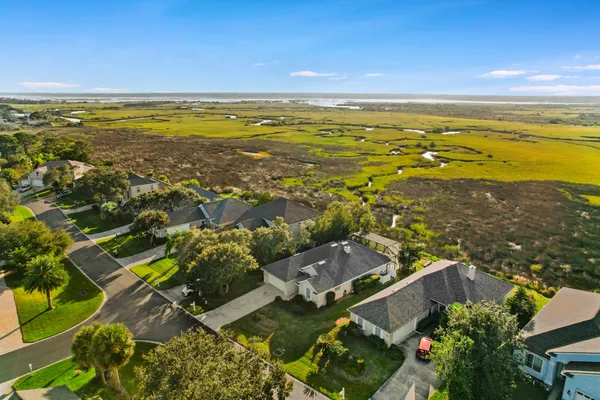 an aerial view of residential building and ocean
