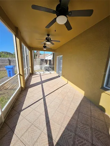 a view of a house with backyard porch and sitting area