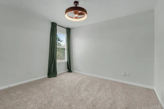 a spacious bathroom with a double vanity sink a mirror and a bathtub