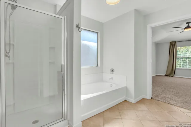 a view of wooden floor and windows in a room