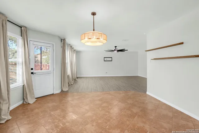 a kitchen with kitchen island microwave and refrigerator